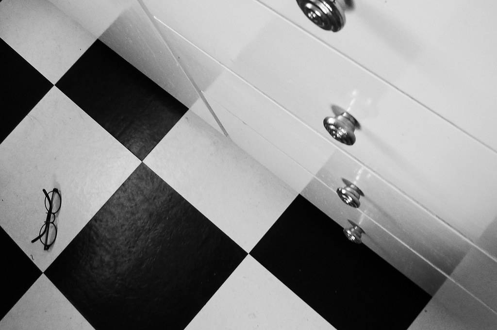 reading glasses on tiled floor